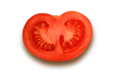 Cut half of tomato on white backgroundの写真素材