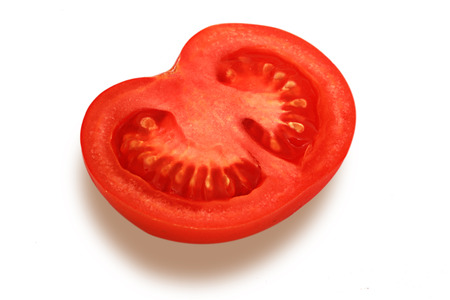 Cut half of tomato on white backgroundの写真素材