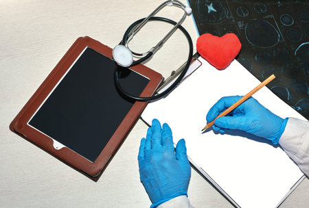the doctor writes down the medical history