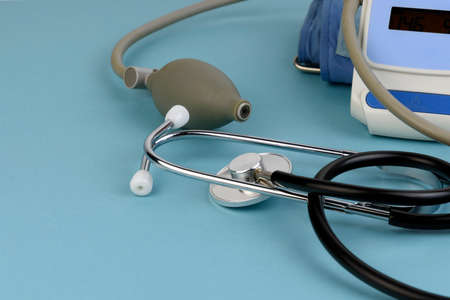 tonometer and phonendoscope on a blue background goes out of focusの写真素材