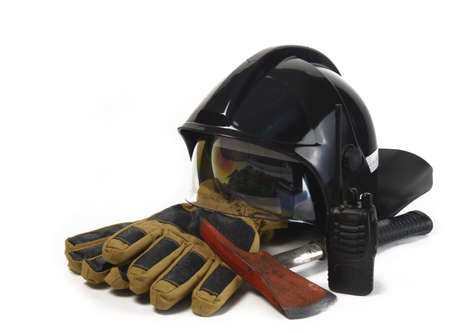 firefighter helmet, black on a white background, not much deployed to the side, fire ax, protective gloves and a radio station, isolateの写真素材