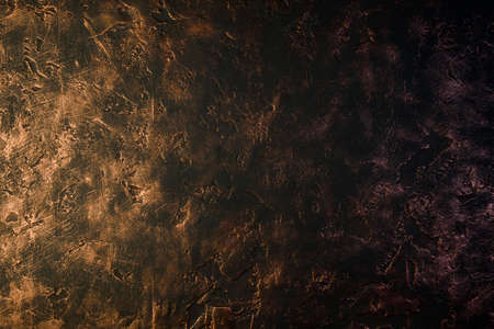 black background interspersed with copper, heterogeneous structure, depressions and shellsの写真素材