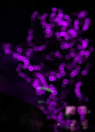 background in lilac tones, night lighting in out of focusの写真素材