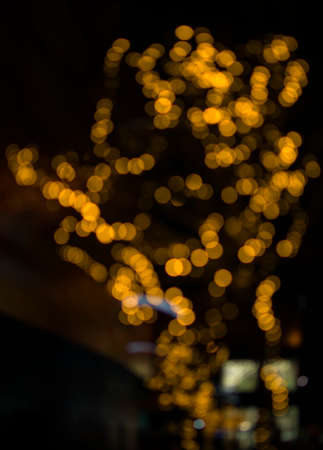 background in yellow tones, night lighting in out of focusの写真素材