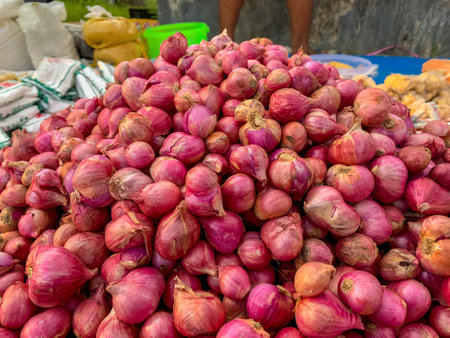 Close-up Shallots, this is an important food ingredient in Indonesia. red onions sold in the marketの写真素材