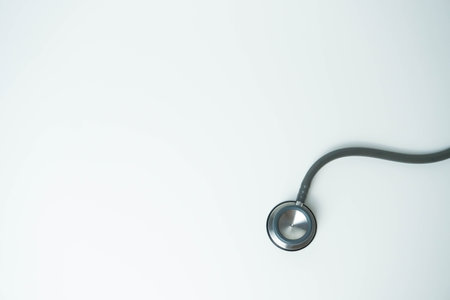 Stethoscope isolated on white background, top view. Medical tool. Health care concept. Copy spaceの写真素材