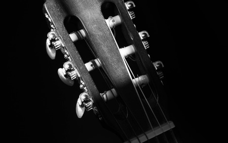 Close-up of guitar strings on a guitar fretboard, white and black stylish.の写真素材