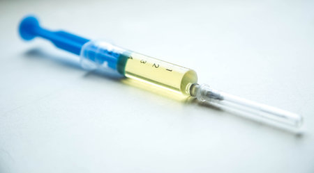 Syringe with a drug, medicine on a white backgroundの写真素材
