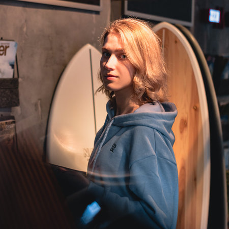 Young girl with wight hear and blue sweater