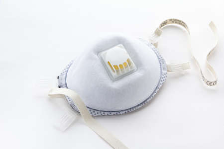 Medical mask, Medical protective mask on wight background. Disposable surgical face mask cover the mouth and nose.の写真素材