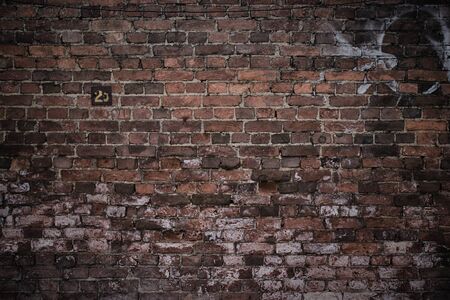 Antique brick wall vintage texture of red stone blocks as backgroundの写真素材