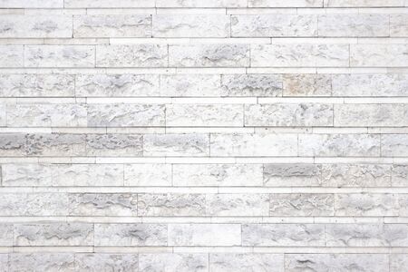 Bright texture of stone blocks, white interior as backgroundの写真素材