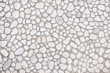 white wall of small stones, background light interiorの写真素材