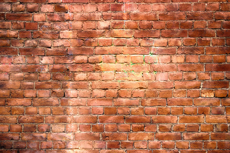 red brick wall, urban exterior, ancient weathered surfaceの写真素材