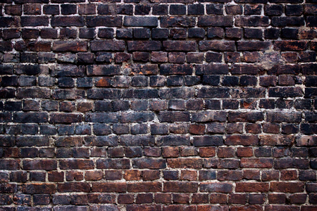 Old brick wall, black background textureの写真素材