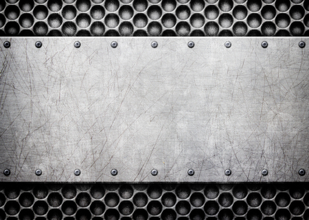 brushed steel metal plate background with rivetsの写真素材