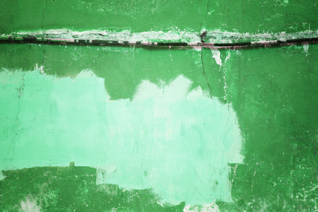 concrete wall painted in green color, texture plaster close-upの写真素材