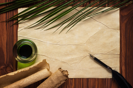 black quill pen and ink on old paper backgroundの写真素材