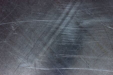 Dark titanium plate, gray metal texture as backgroundの写真素材