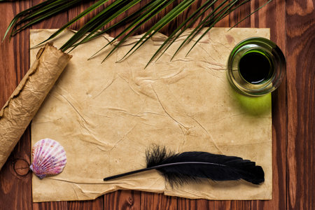 Quill pen, inkwell on open scroll, background for textの写真素材