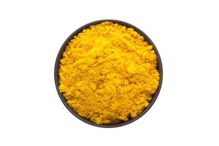turmeric powder in bowl, top view, isolated on a white background. organic spiceの写真素材