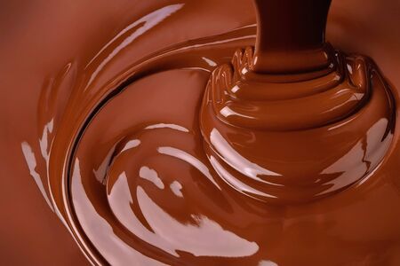 splash of melted chocolate. sweet cocoa dessert, dark chocolate backgroundの写真素材