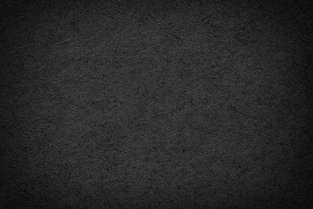 black paper background with blank space. dark texture as wallpaperの写真素材