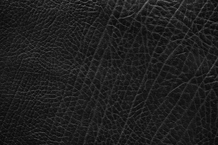 Natural texture of black leather. dark abstract background