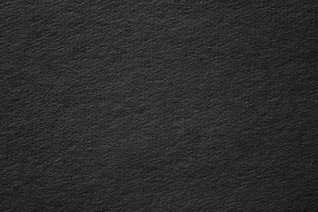 abstract texture of black poster. dark paper background with vignetteの写真素材