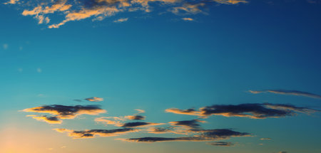 stunning sunset over the sea, colorful clouds absorb the sun's raysの写真素材