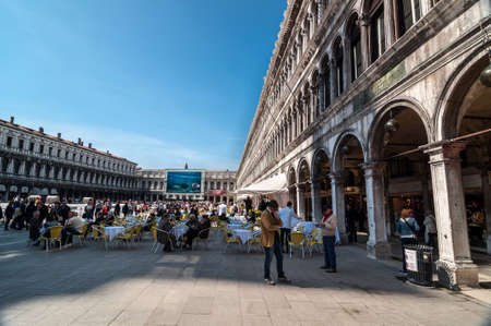 VENICE, ITALY - APRIL 13: People visit San Marco square in Venice on April 13, 2013. Millions of tourists visit Venice city center a year, the city of gondolas is the most romantic italian city. Venice, Italy,  April 13, 2013のeditorial素材