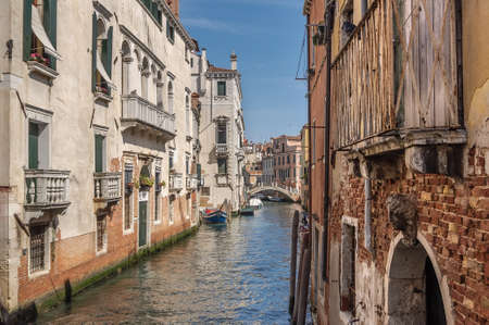 Venetian canal Rio de la Pleto. Old walls with balcony and architecturical elements. Venice, Veneto, Italyのeditorial素材