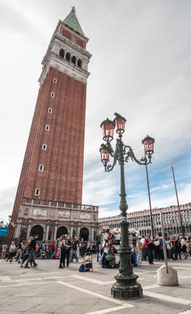 VENICE, ITALY - APRIL 13, 2013 : Decorative lampposts in Piazza San Marco against campanile San Marco in Venice, Italy.のeditorial素材