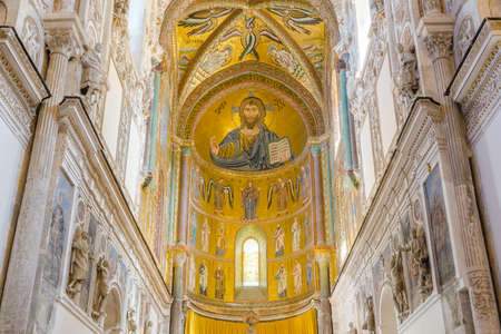 CEFALU, ITALY - SEPT 11, 2015: Interior of the Cathedral-Basilica of Cefalu. Duomo di Cefalu. Main nave with the mosaic of Christ Pantocrator in Byzantine style. Cefalu, Sicily, Italy.のeditorial素材
