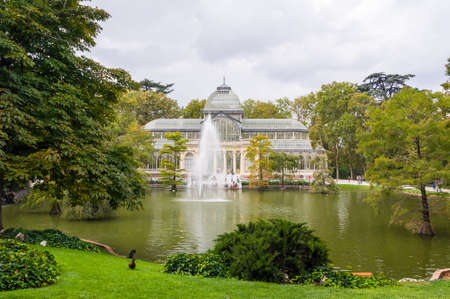 MADRID, SPAIN - SEPTEMBER 27, 2014: Crystal Palace (Palacio de Cristal). Glass and metal structure located in Buen Retiro Park, Madrid, Spain.のeditorial素材