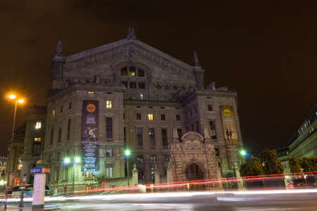 PARIS - SEPT 17, 2014: Night view of the facade of the Palais Garnier opera house or Paris Opera. It was originally called the Salle des Capucines. Architectural style is Second Empire and Beaux-Arts.のeditorial素材