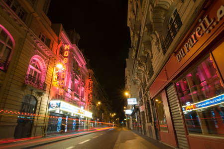 PARIS - SEPT 17, 2014: Traffic lights and night view of the Theatre Megador. It founded in 1913 and designed by Bertie Crewe, is a Parisian music hall theatre located at 25, rue de Mogador, Paris.のeditorial素材