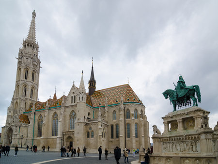 BUDAPEST, HUNGARY - FEBRUARY 20, 2016: Matthias Church is a Roman Catholic church located in Budapest, Hungary, in front of the Fisherman's Bastion at the heart of Buda's Castle Districtのeditorial素材