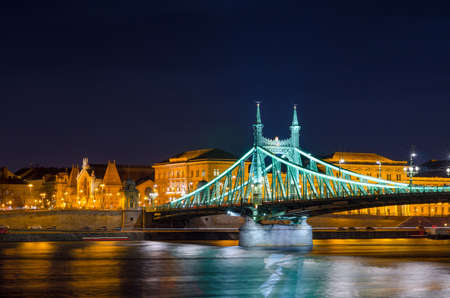 BUDAPEST, HUNGARY - FEBRUARY 22, 2016: Night view of Liberty Bridge - Freedom Bridge in Budapest, Hungary, connects Buda and Pest across the River Danube.のeditorial素材
