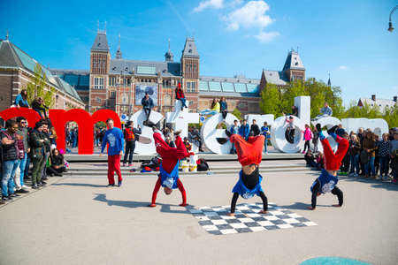 Amsterdam, Netherlands - April 20, 2017: Youth break dancing on city streets in Amsterdam. Street festival breakdance.のeditorial素材