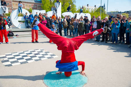 Amsterdam, Netherlands - April 20, 2017: Youth break dancing on city streets in Amsterdam. Street festival breakdance.のeditorial素材