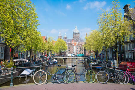 Amsterdam, Netherlands - April 20, 2017: Bicycle on the city street river channel bridge in Amsterdam.のeditorial素材