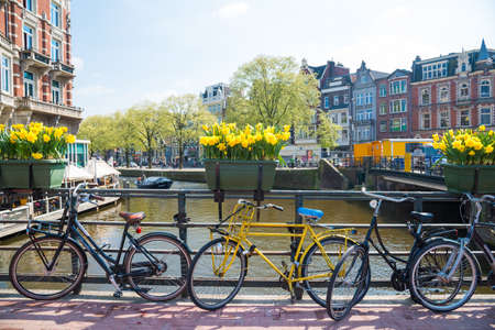 Bikes on the bridge in Amsterdam Netherlands.のeditorial素材