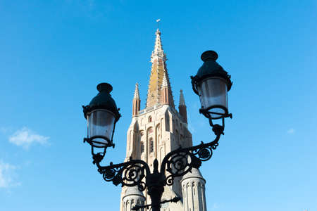 Tower of the church of Our Lady in the historical centre town of Bruges, Belgium.の写真素材