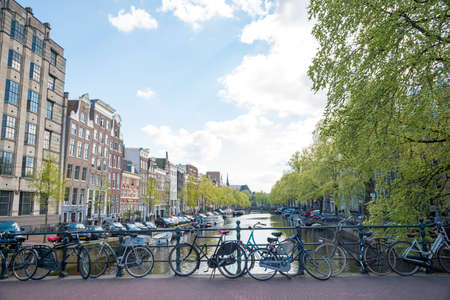 Amsterdam, Netherlands - April 19, 2017: Bicycles on a bridge over the canals of Amsterdam. Amsterdam is the capital and most popular city of the Netherlandsのeditorial素材