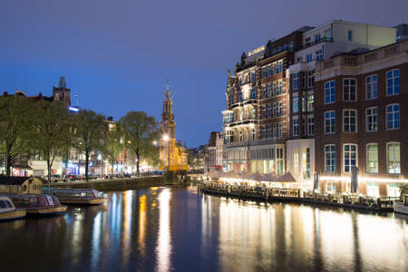 Munttoren Tower at Muntplein square Amsterdam Netherlands at duskのeditorial素材
