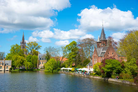 Minnewater castle at the Lake of Love in Bruges, Belgiumのeditorial素材
