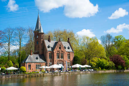 Bruges, Belgium - April 17, 2017: Minnewater castle at the Lake of Love in Bruges, Belgiumのeditorial素材