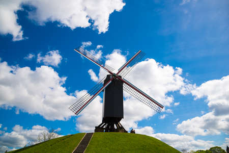 Windmill in Bruges, Northern Europe, Belgium. Historical building preserved for tourism in the city, along the canals.の写真素材