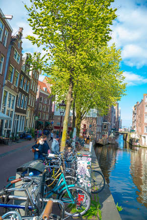 Amsterdam, Netherlands - April 19, 2017: Important tourist attraction in Amsterdam - the small canals in the city center.のeditorial素材